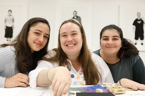 Clients enjoy a creative art project led by Lynn Menlo at Grand Opening Celebration